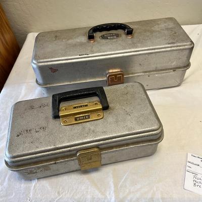 Two tackle boxes with hooks and flies