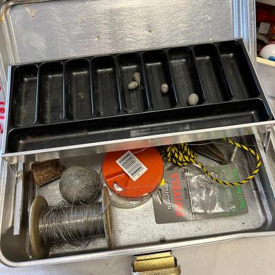 Two tackle boxes with hooks and flies