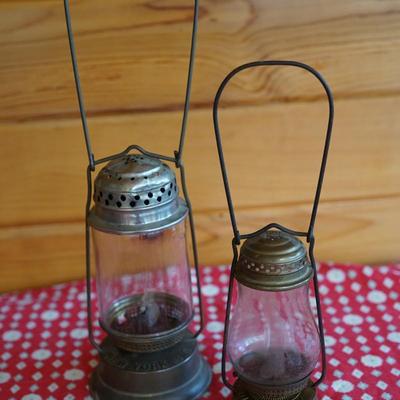 PAIR OF ANTIQUE DIETZ SKATERS LANTERNS . ONE RACKET AND ONE BOY