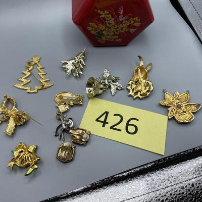 Lot of Christmas pins in box