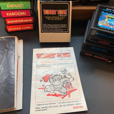 LOT:109: Vintage Video Games Atari Computer System, Video Game Cartridges and Booklets from Atri and Coleco Actrivision