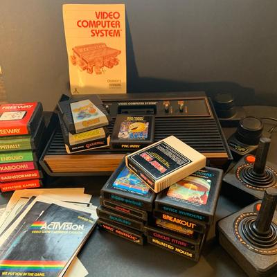 LOT:109: Vintage Video Games Atari Computer System, Video Game Cartridges and Booklets from Atri and Coleco Actrivision