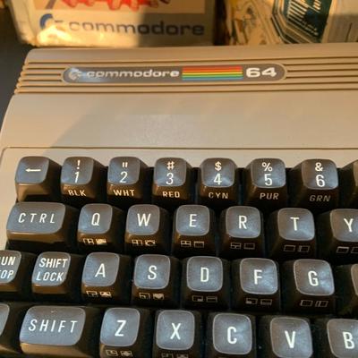 LOT:110: Comodore 64 Computer with Programing and Users Guides, Music Machine Program Cartridge with Original Boxes and Power Cord