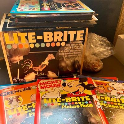 LOT:112: Vintage Lite-Bite in Original Box, pegs, and a Large Collection of Refills Including Mickey Mouse, Gremlins, Snoopy and More