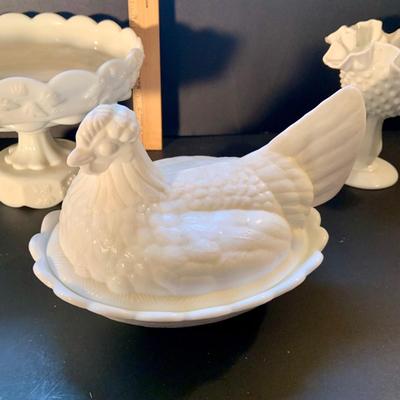 LOT:116: Vintage Milk Glass Collection Featuring a Fenton Hen on a Nest, Hobnail Compote Candy Dish, also a Shoe and Cake Plate