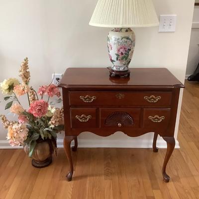 Thomasville cherry low boy 30â€H 32â€W 18â€depth lamp 26â€H floral arrangement