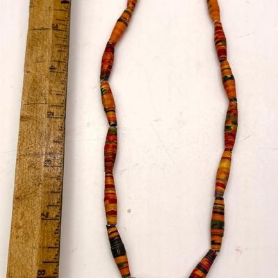 Necklace with paper rolled beads and wood heart pendant