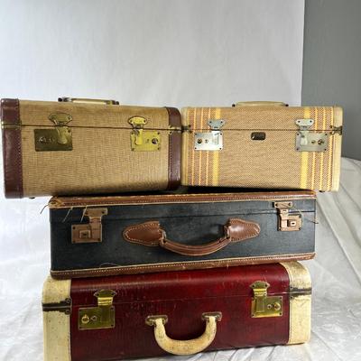 Four vintage suitcases