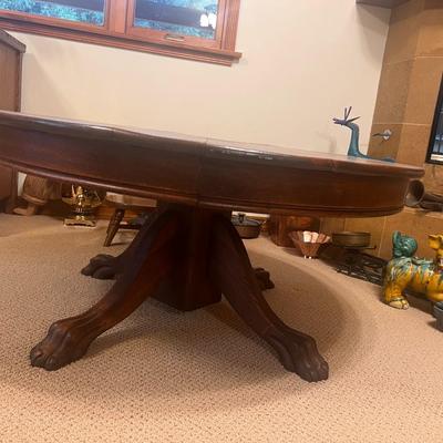 Hand Carved Pedestal Round Table with Lion's Paw Feet