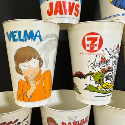 LOT 72A: Vintage 7/11 Slurpee Cup Collection Of Cartoons & Movies - Scooby Doo, Jaws & More