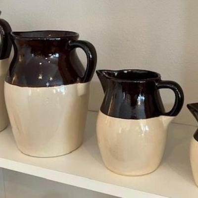 Four Vintage Stoneware Two Tone Pitchers