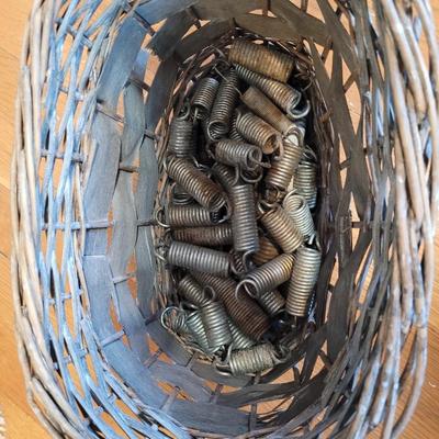 Lot of assorted springs in a basket