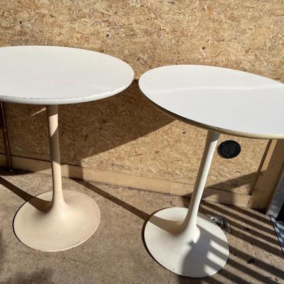 2 round white tables