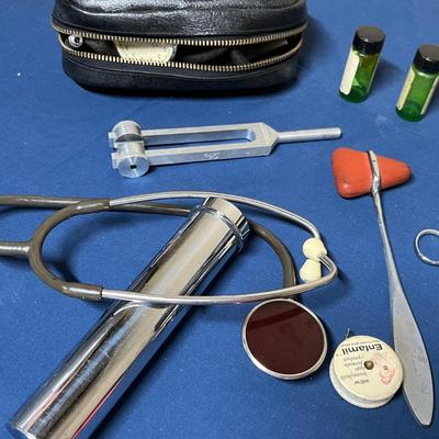 Antique doctor bag with vintage items