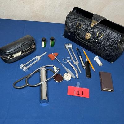 Antique doctor bag with vintage items