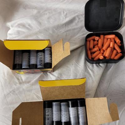 Two boxes of 12 guage dummy loads and another box of plastic bullets
