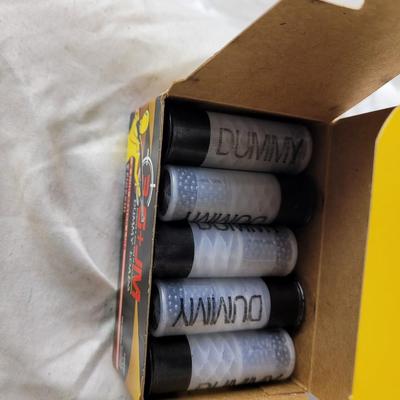 Two boxes of 12 guage dummy loads and another box of plastic bullets