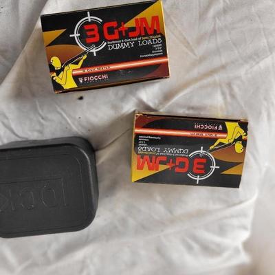 Two boxes of 12 guage dummy loads and another box of plastic bullets