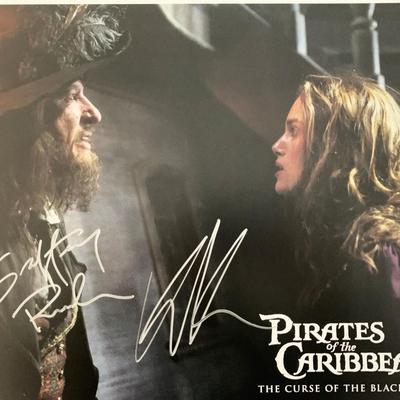 Pirates of the Caribbean: The Curse of the Black Pearl Geoffrey Rush and Keira Knightley signed lobby card. GFA Authenticated