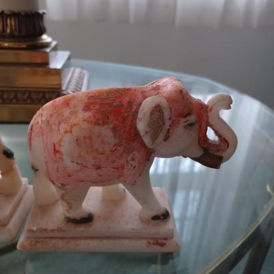 2 stone/marble elephants trunk up