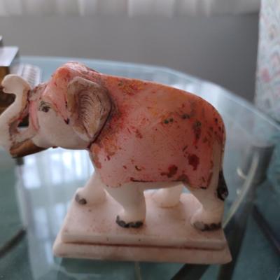 2 stone/marble elephants trunk up