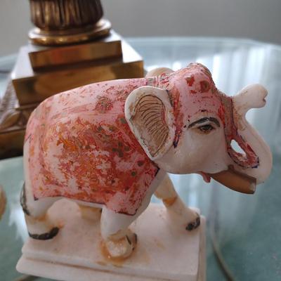2 stone/marble elephants trunk up