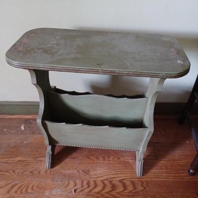 green wooden magazine stand