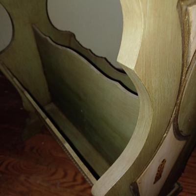 green wooden magazine stand