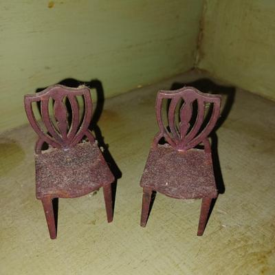 pair of plastic dollhouse chairs