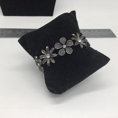 Black flower bracelet with faux gems