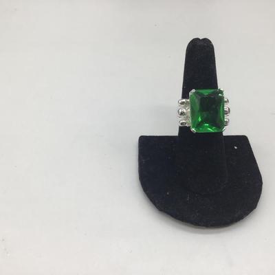 Green gem with silver ring