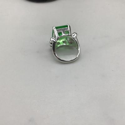 Green gem with silver ring