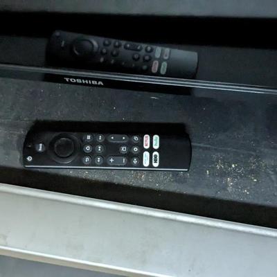 Toshiba Fire TV with Stand and Samsung TV