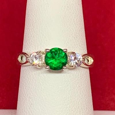 LOT:33: Sterling Silver Ring with Emerald Green & CZ's. Size 7
