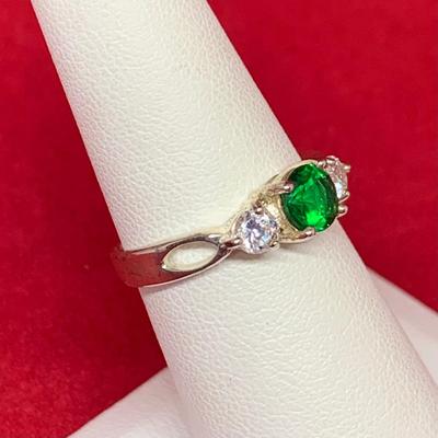 LOT:33: Sterling Silver Ring with Emerald Green & CZ's. Size 7