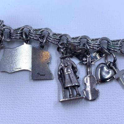 LOT 57: Sterling Silver Charm Bracelet w/ 18 Sterling Charms