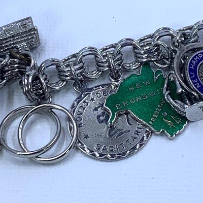 LOT 57: Sterling Silver Charm Bracelet w/ 18 Sterling Charms