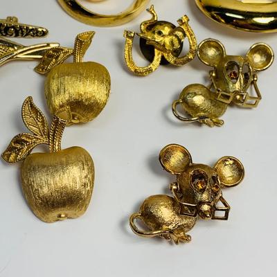 LOT 69: Vintage Gold Tone Brooch Collection: Avon & More