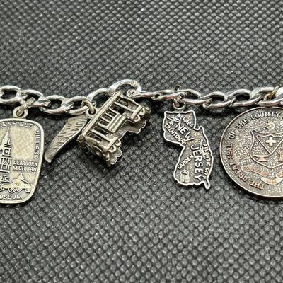 LOT 91: Sterling Silver Aries Pin & Sterling Silver Souvenir Travel Charm Bracelet w/Charms