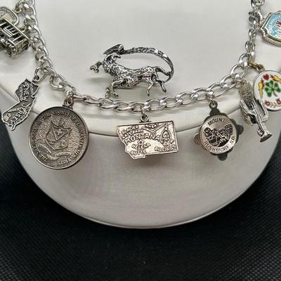 LOT 91: Sterling Silver Aries Pin & Sterling Silver Souvenir Travel Charm Bracelet w/Charms