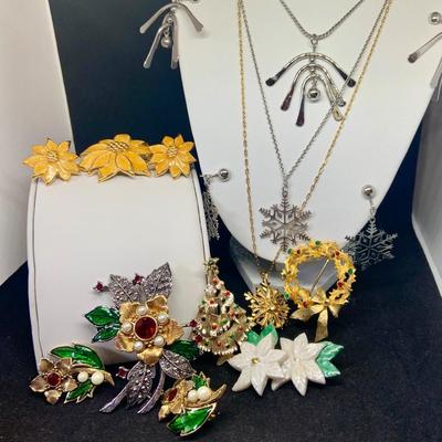LOT:117: Assortment of Avon Holiday Jewerly Including Pins Clip-on Earrings Necklaces and More