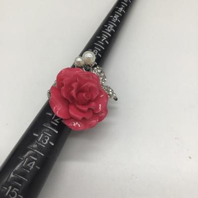 Adjustable pink rose ring