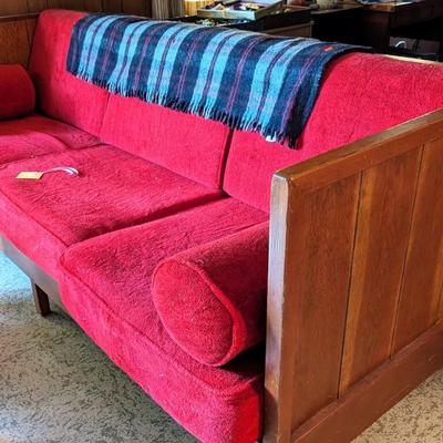 Red sofa. Loose cushions. Wood frame