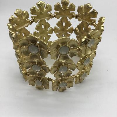 Bulky gold toned flower bracelet
