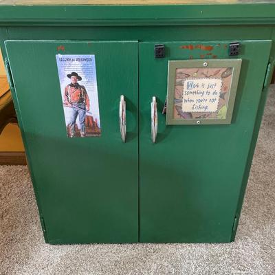 Small green cabinet with drawer