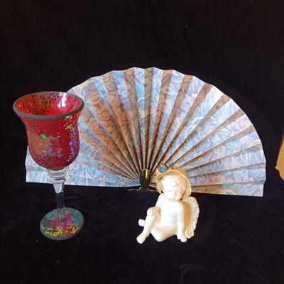 FREE STANDING FAN, CERAMIC CHERUB AND A CLASS CANDLE HOLDER