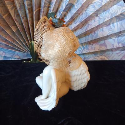 FREE STANDING FAN, CERAMIC CHERUB AND A CLASS CANDLE HOLDER