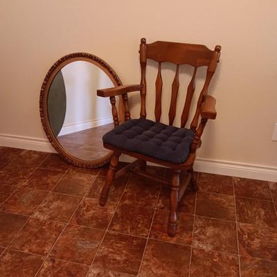 WOODEN FRAMED OVAL WALL MIRROR AND SOLID WOODEN ARMED CHAIR