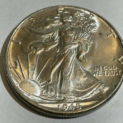 1945-P UNCIRCULATED CONDITION WALKING LIBERTY SILVER HALF DOLLAR AS PICTURED.