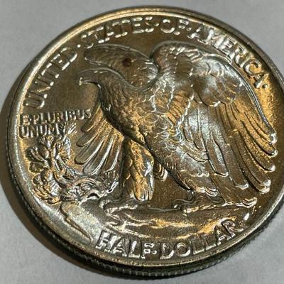 1945-P UNCIRCULATED CONDITION WALKING LIBERTY SILVER HALF DOLLAR AS PICTURED.